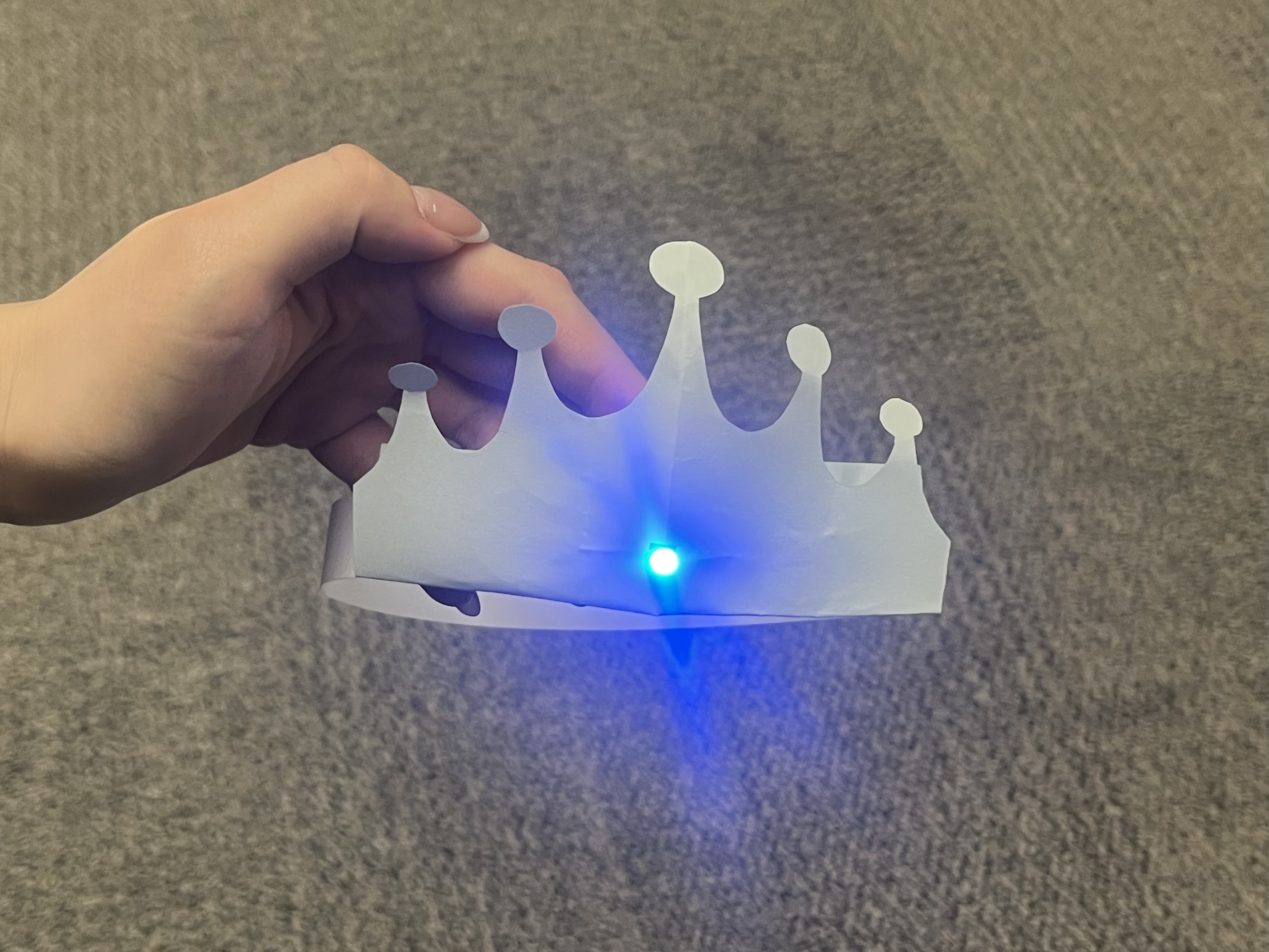 The circuit inside of the crown will be activated if the crown is worn by user.