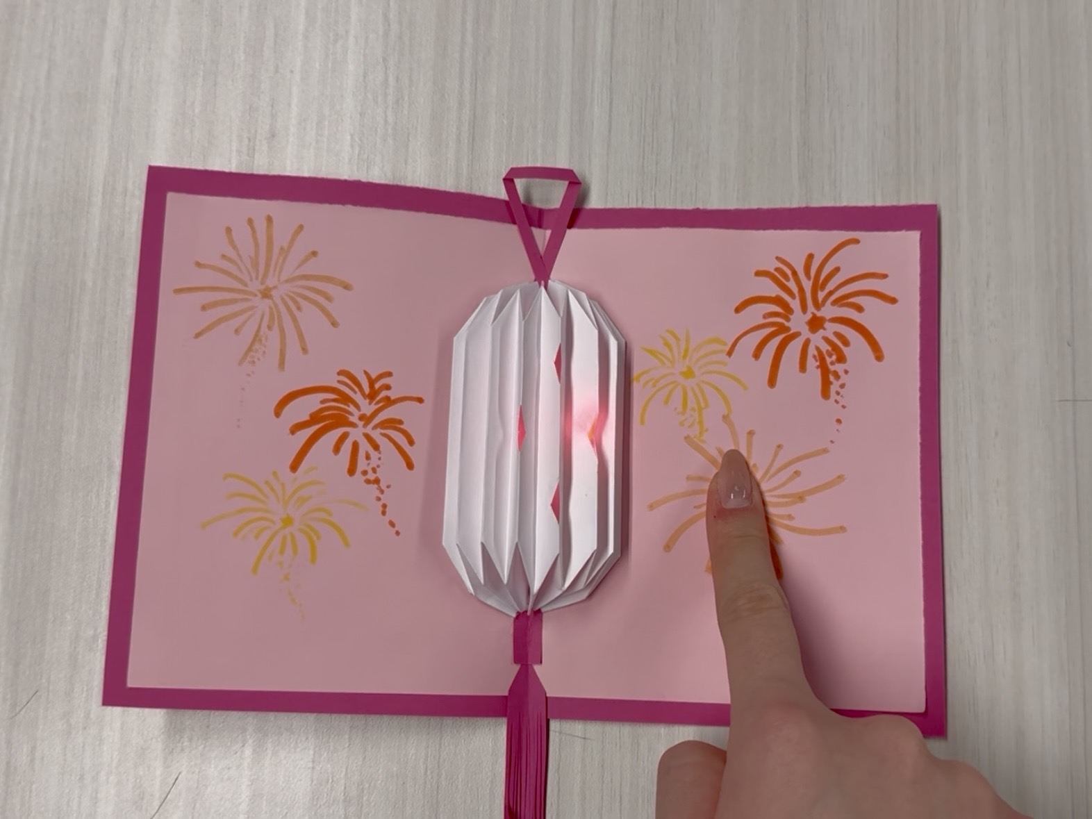 The light inside of the lantern will be turned on once the firework is pressed.